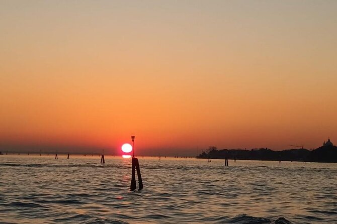 Aperitif at sunset in the Venice lagoon on a private boat. - Stop 2: Isola delle Vignole and the shift from vineyards to retreats