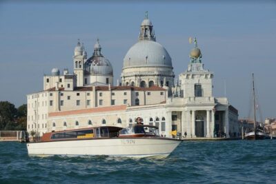 Private Arrival Transfer: Venice Train or Bus Stations to Venice Hotels - What happens after you meet: voucher, boat, and the ride itself